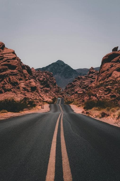 Empty road through a red rock canyon