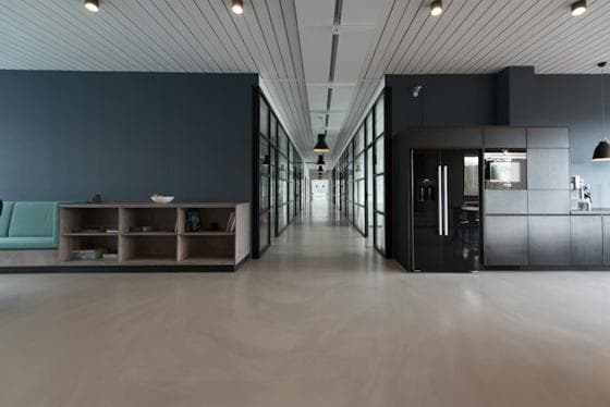 Minimal office corridor with concrete floor