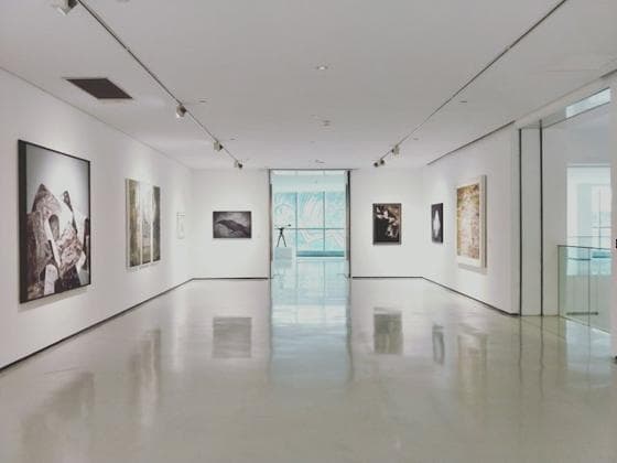White gallery space with framed prints
